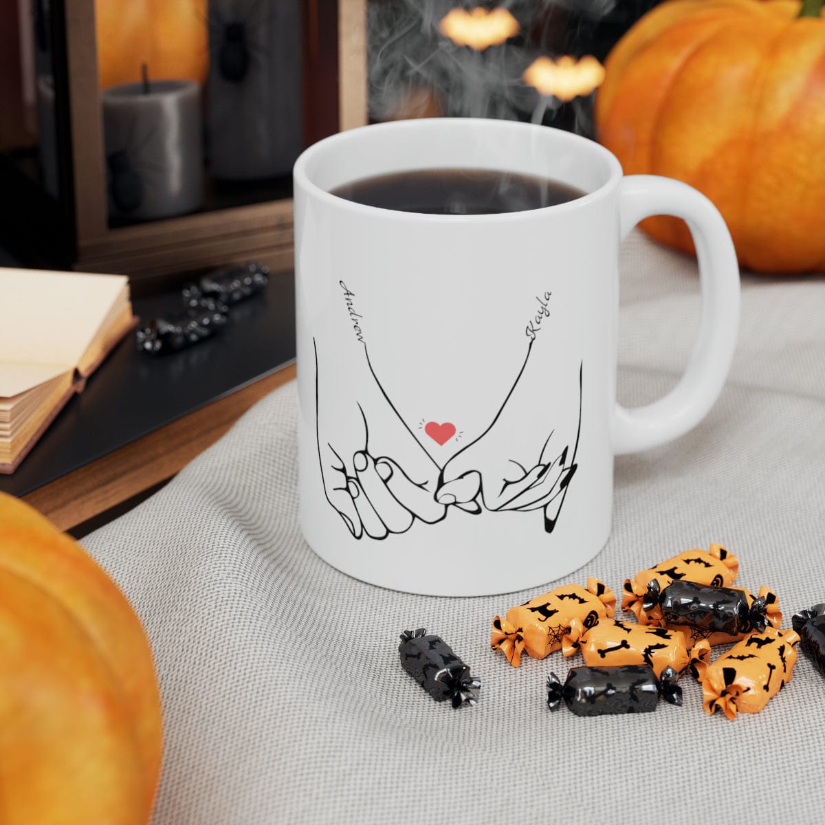 Line art drawing graphic of hands holding pinkies with the couple's names added to personalize the coffee mug