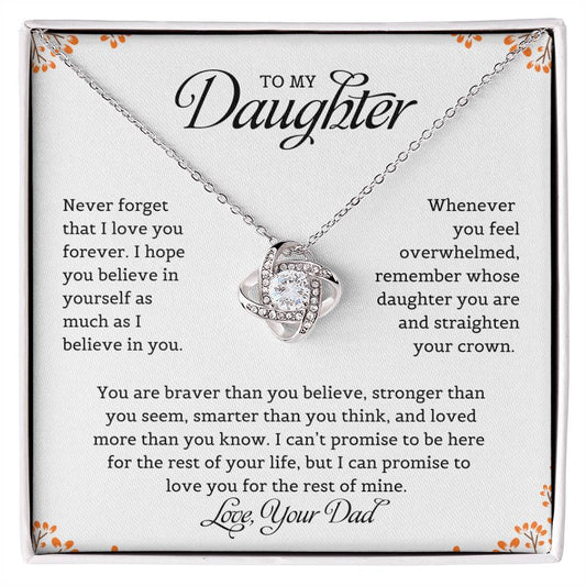 A necklace with a love knot pendant, accompanied by a card with a message to the daughter from dad expressing love and belief in her.