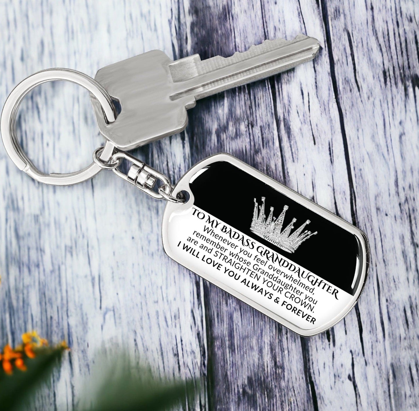Gift for granddaughter Swivel dog tag keychain with the inscription "TO MY BADASS GRANDDAUGHTER Whenever you feel overwhelmed, remember whose Granddaughter you are and STRAIGHTEN YOUR CROWN. I will love you always & forever," exclusive to Design It Personal