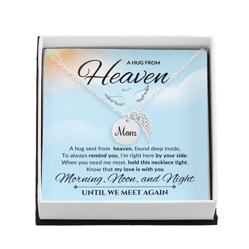 An emotional tribute necklace for mom, showcasing angel wings and a pendant with a heartfelt poem. The pendant is elegantly displayed against a serene backdrop, conveying everlasting love and fond memories.