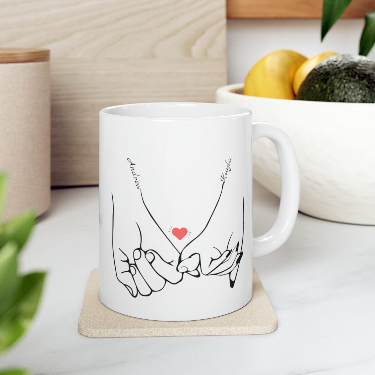 Line art drawing graphic  of hands holding pinkies with the couple's names added to personalize the coffee mug