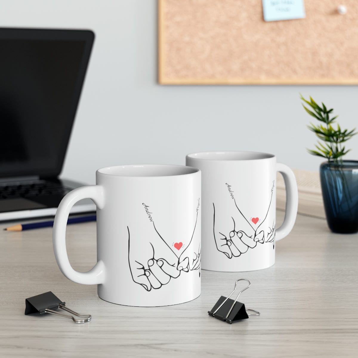 Line art drawing of hands holding pinkies with the couple's names added to personalize the coffee mug